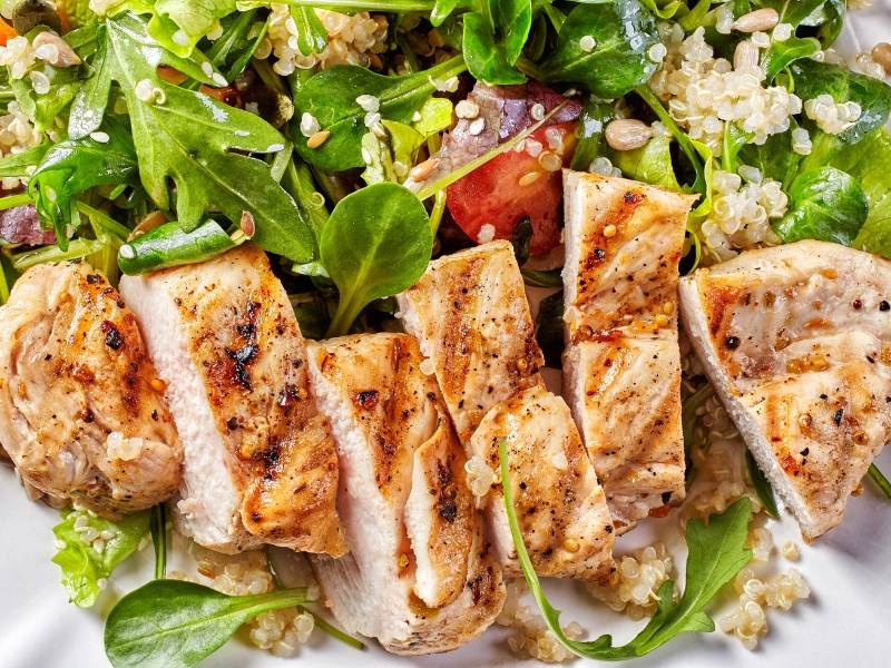 Quinoa and vegetable salad with grilled chicken