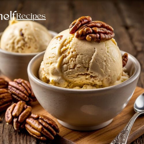 Bowl of rich, creamy butter pecan ice cream with golden toasted pecans on top, served with a spoon on a rustic wooden table