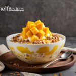 Bingsu topped with fresh mango and condensed milk