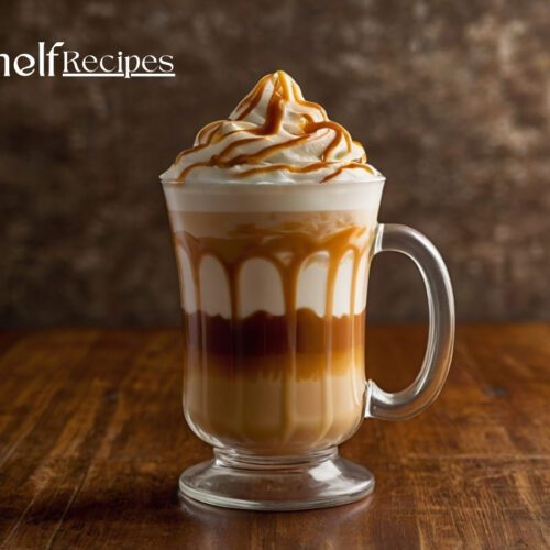caramel macchiato with distinct layers of milk, espresso, and foam, topped with a rich caramel drizzle in a crosshatch pattern.